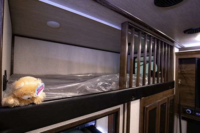 The closeup photo of the loft sleeping area of the Dutchmen Voltage 3635 toy hauler fifth wheel RV. 