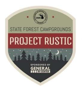 The Project Rustic logo is an olive green badge with a red band across the middle that reads Project Rustic. At the bottom of the badge is an illustrated forest scene with trees silhouetted against a starry sky with a moon.