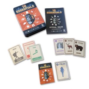 Image showing 10 Essentials card game, including game cards, rules sheet, and game board.