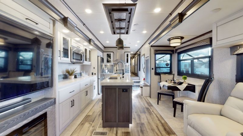 Inside the Redwood RV you will find a spacious interior with bright design. The photo showcases the luxurious living space.